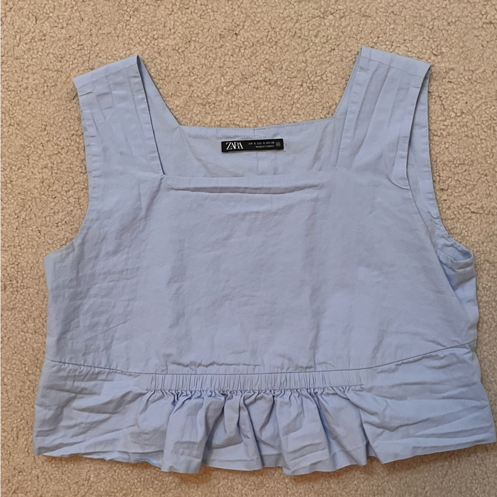 Baby blue cropped top with ruffles on the bottom